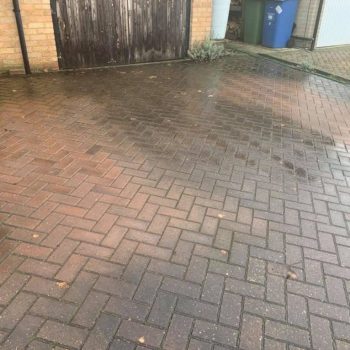 Before our team visted this block paved driveway it was stained with years of dirt and vehicle use.