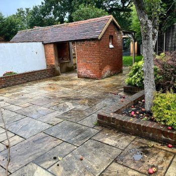 Before our team visited this Indian sandstone patio it was looking tired, old and covered in years of dirt.